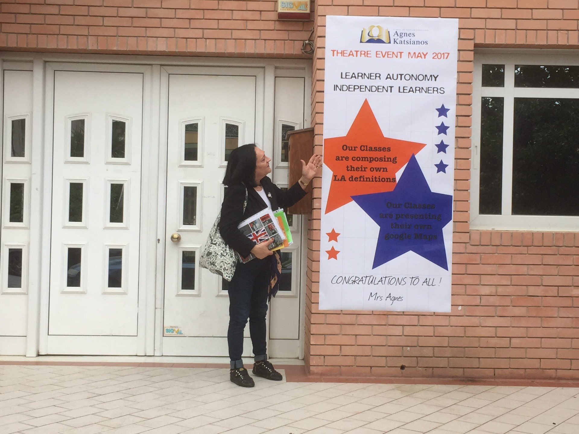 Dr. Agnes Katsianos in front of the Learner Autonomy poster