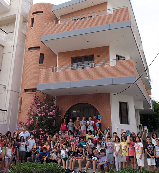 Group photo of students at the school entrance